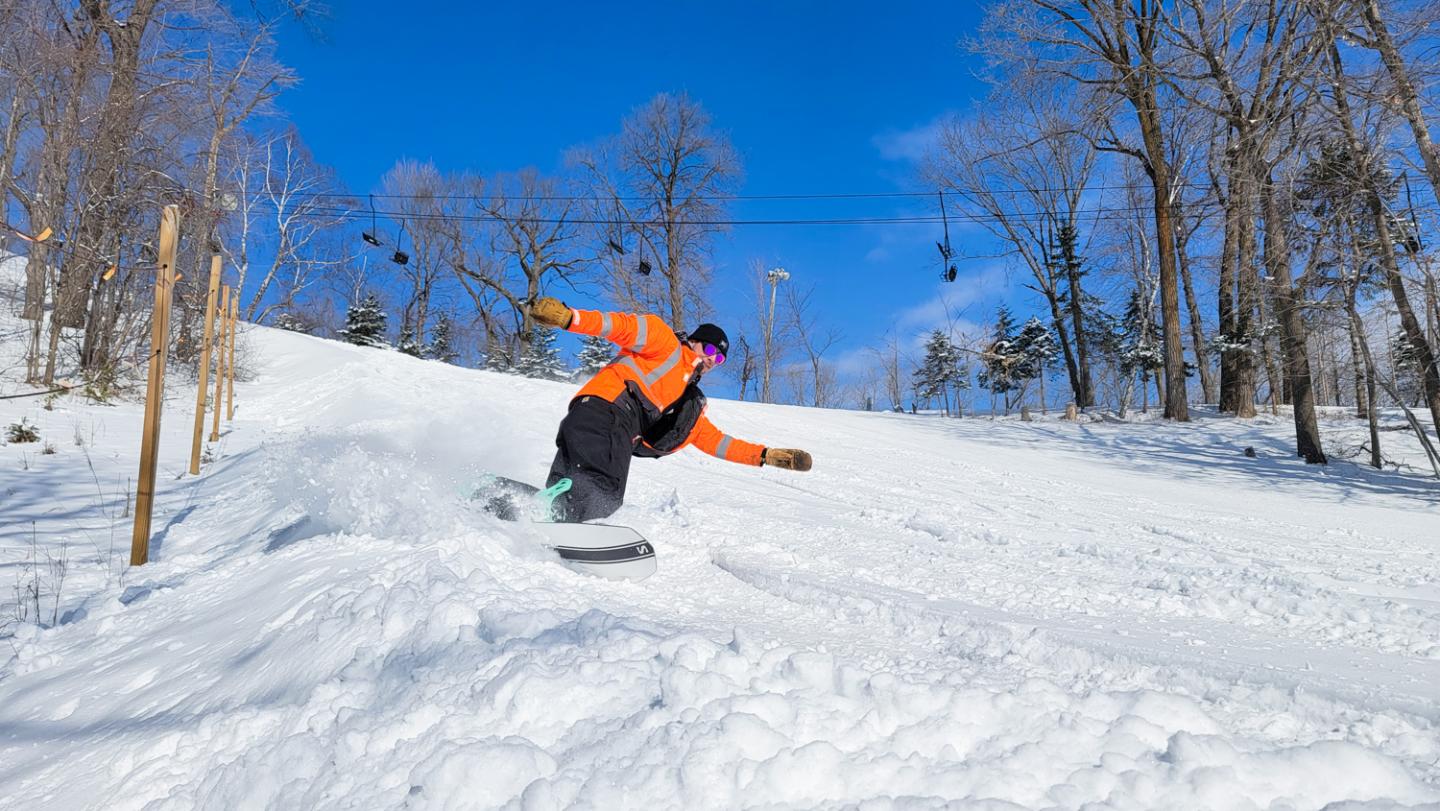 snowboarder coming down mountain