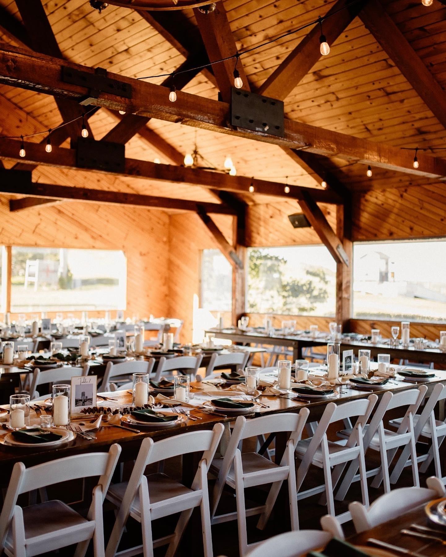 wedding venue setup with chairs and table settings