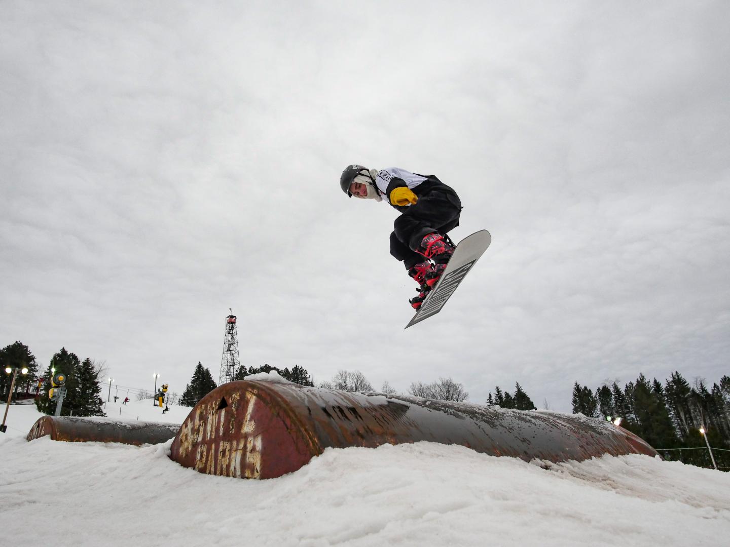 snowboarder mid jump in terrain park