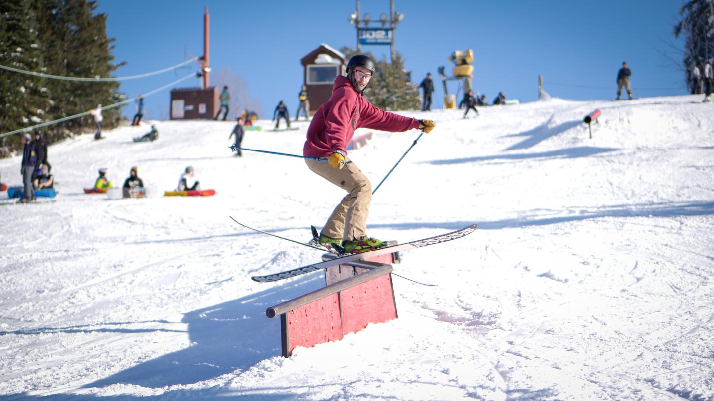 Skier on rail in terrain park