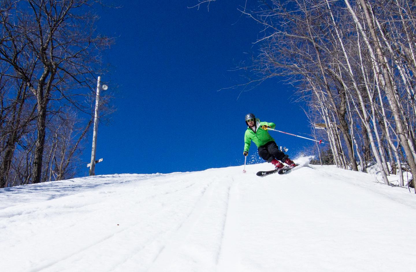 skier carving down ski hill