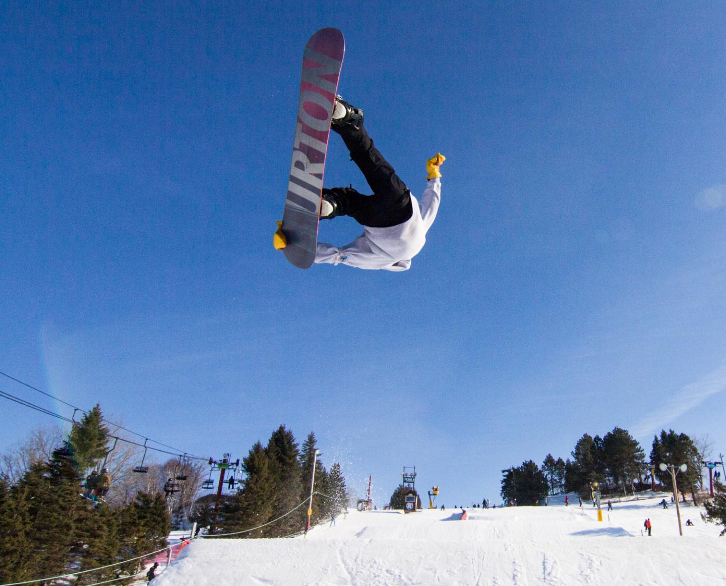 snowboarder upside down, after jump