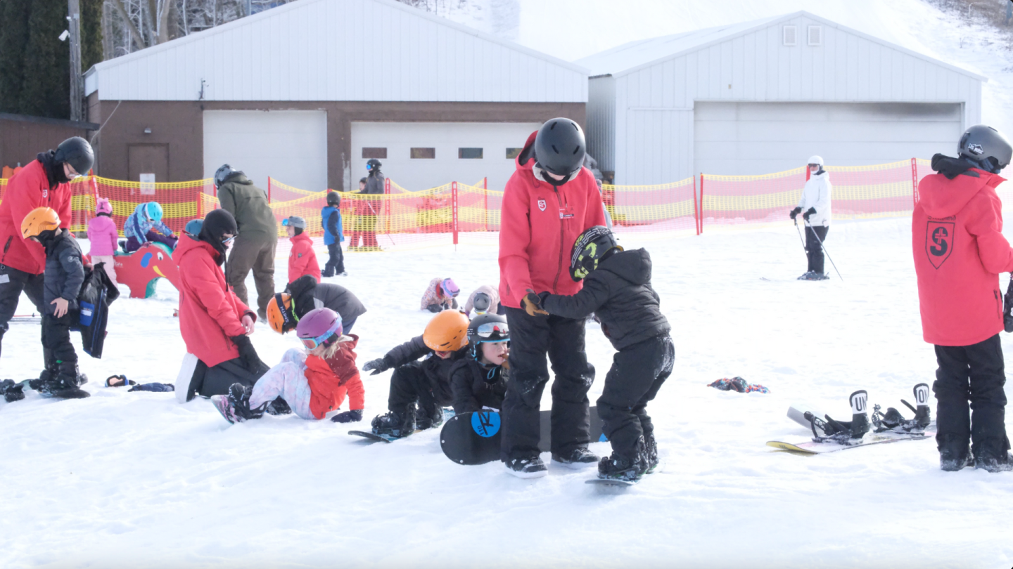group of instructors and children
