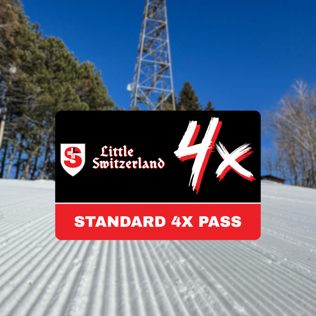 Ski pass card on groomed snow, blue sky, and trees in the background.