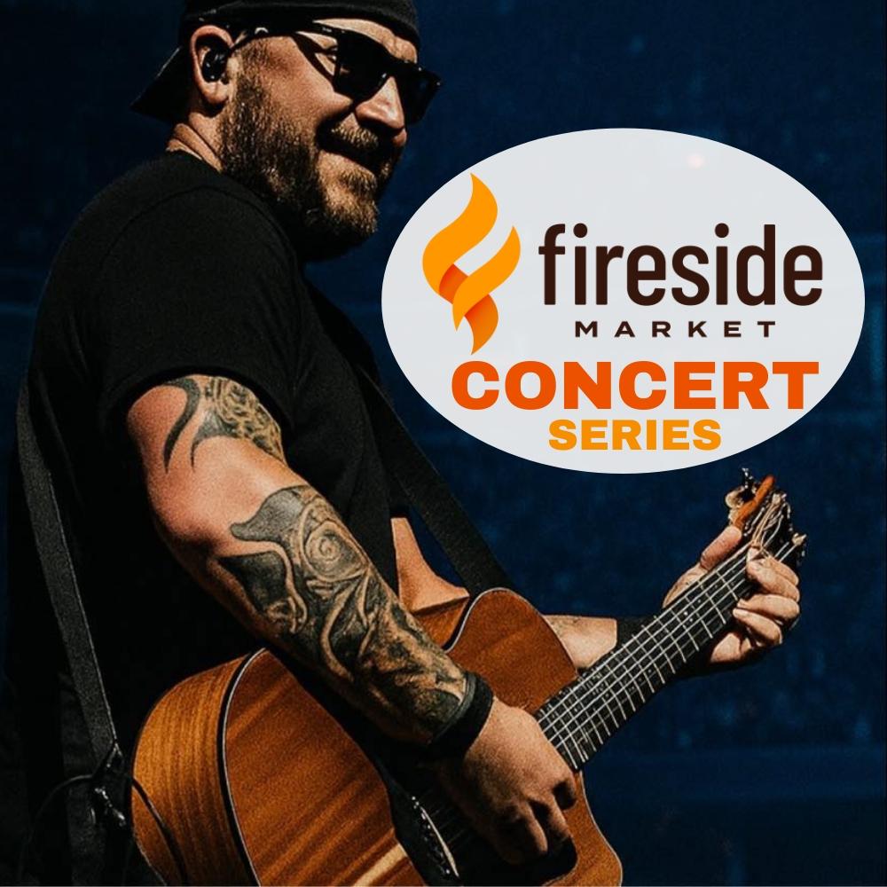 Musician with guitar at Fireside Market Concert Series.