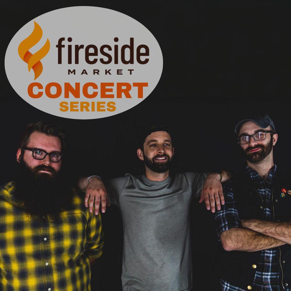 Three men stand under a fireside market concert series logo.
