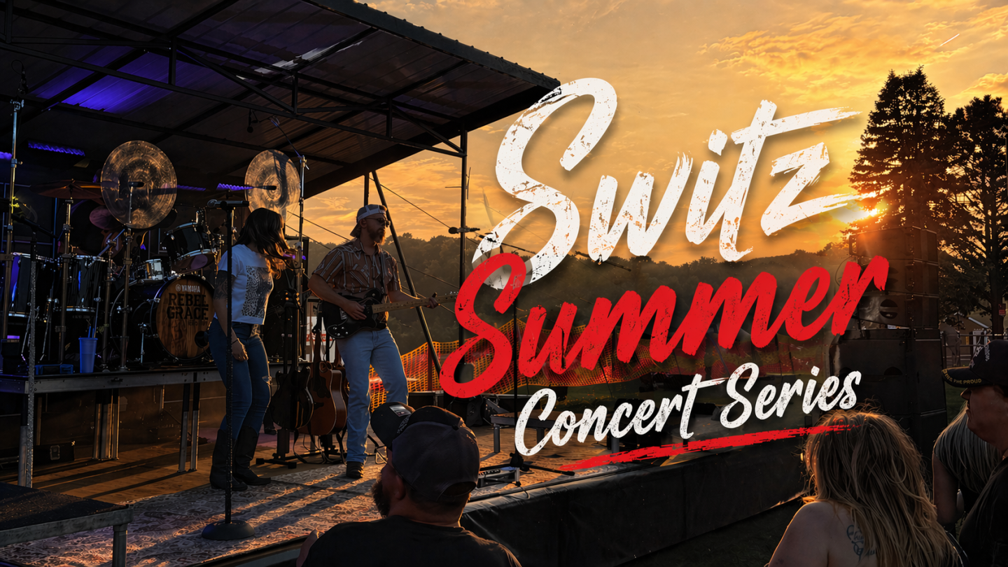 Band performing on stage at sunset during an outdoor concert.